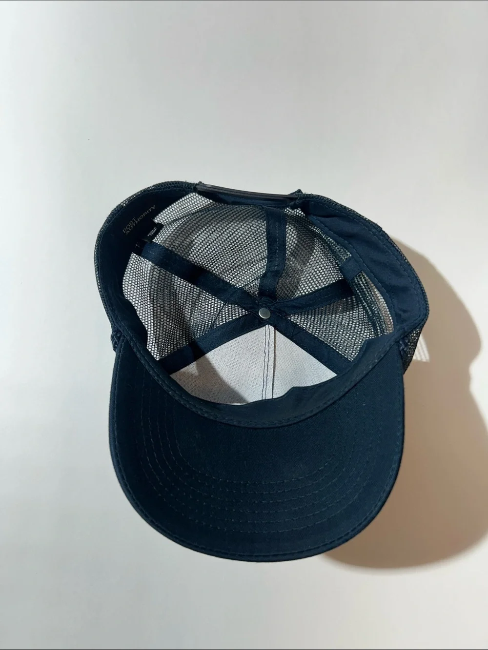 Port Authority Navy Blue Trucker Cap with White Logo